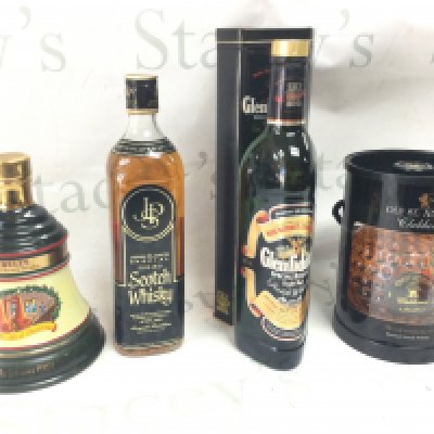 Four whiskeys - Bells Christmas 1991, John Player Special scotch, Glenfiddich Single Malt Scotch, Old St Andrews Clubhouse blended scotch. This lot cannot be posted