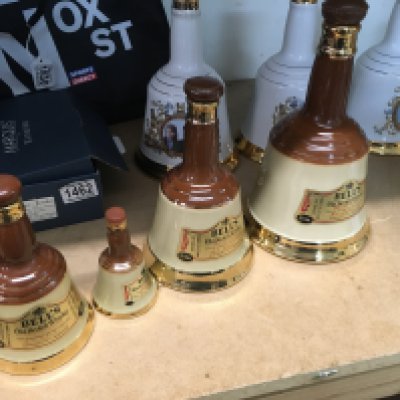 A Collection of 10 bells scotch whisky decanters various commemorative.