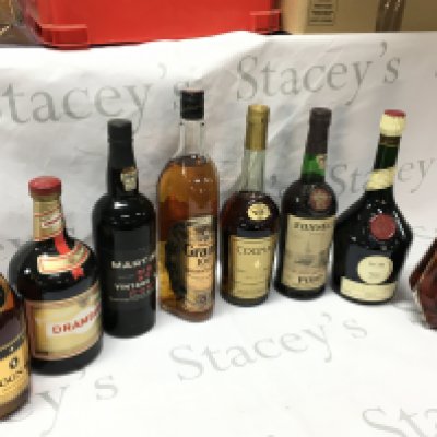 A Collection of spirits including Cognac Bisquit , Benedictine, Fonseca port, Cognac vs, Grants scotch, Martinez 1975 port , Drambuie liquer, French cognac . This lot cannot be Posted