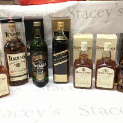 A Collection of boxed whiskeys including House of Lords deluxe blended Scotch whiskey , Teachers Highland cream scotch, Glenfiddich pure malt scotch whiskey, Johnnie Walker black label extra special old scotch, Single malt Cardhu scotch