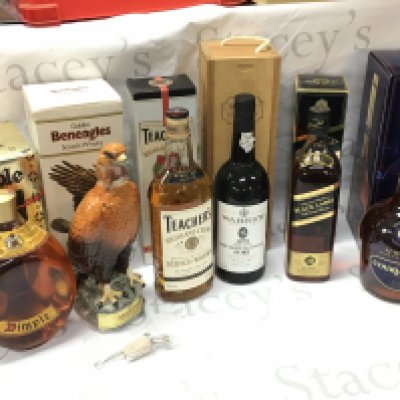 Boxed whiskeys including Dimple, Golden Beneagles scotch, Teachers highland cream scotch, Warres 1970 Late bottled vintage port, Jonnie Walker black label, VSOP COGNAC Courvoisier. This lot cannot be posted