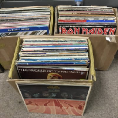 Three boxes of LPs and 12" singles by various artists including The Beatles, Queen, Iron Maiden and others. Shipping category D.