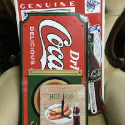 A Collection of vintage metal advertising signs including Coca Cola, Budweiser etc