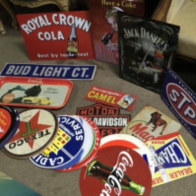 A Collection of vintage metal advertising signs including Harley Davidson, Jack Daniels, Coca Cola , Coca Cola tray , McDonalds, Cadillac, lucky strike etc . Postage category C