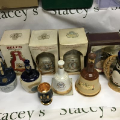 A box of Whiskey and rum decanters.