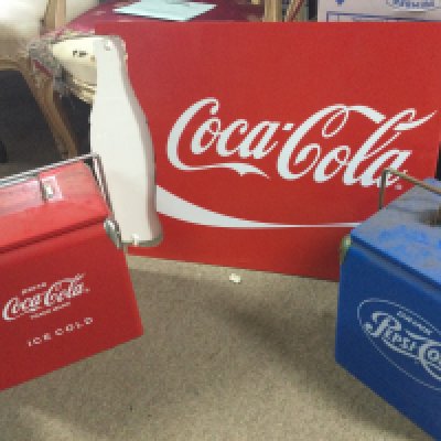 A vintage Coca Cola spinning bottle sign, Coca Cola and Pepsi cooler boxes. 32cm tall. Sign 65cm wide 54cm tall. This lot cannot be posted