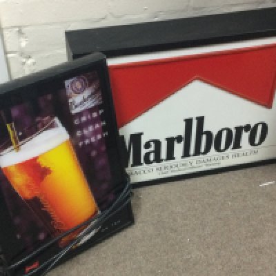 A vintage Marlboro light up sign (44cm wide 60cm tall) and a Budweiser sign (46cm tall 32cm wide) . This lot cannot be posted