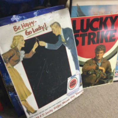A collection of vintage advertising signs including a vintage enamel lucky strike be happy to lucky sign , Camel cigarettes mirror advertising sign, metal signs including Pepsi, Budweiser etc . This lot cannot be posted