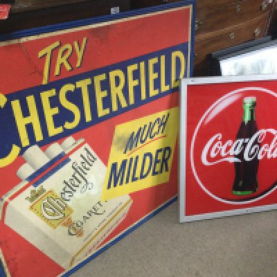 A large vintage cardboard Try Chesterfield much milder cigarette advertising sign (frame 110cm wide 105cm tall) and Coca Cola sign (75cm wide 76cm tall). This lot cannot be posted