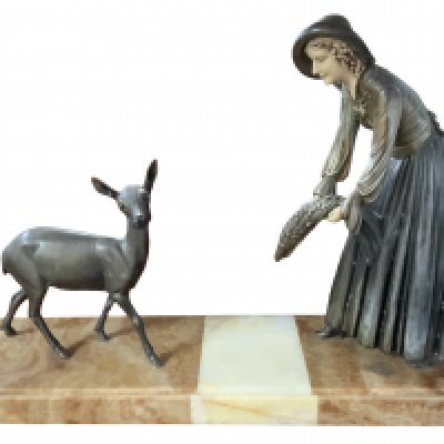 A art deco spelter figure of a lady feeding a fawn mounted on a large alabaster base. 68cm x 44cm x 17cm