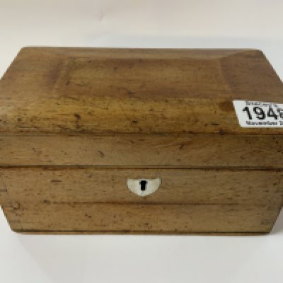 A small Victorian walnut tea caddy together with a mixed collection of vintage marbles.