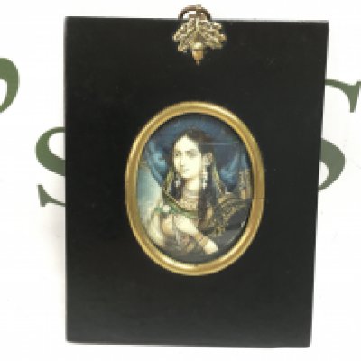 A 19th century ebonised, framed portrait miniature depicting an Indian lady in traditional dress. 10cm x 14cm. NO RESERVE