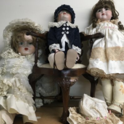 Three Victorian style dolls together with a reproduction dolls corner chair (No reserve) .