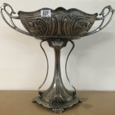 An Art Nouveau style silver plated jardiniere with stylised twin handles and traditional stylised design. 46cm height x 54cm x 25cm