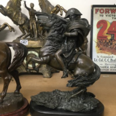 A bronzed figure depicting Napoleon on horseback 30 cm and one other Figure of Napoleon on Horseback. 32 cm .