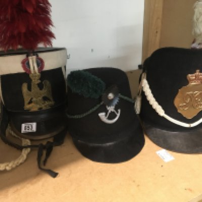 Three Napoleonic Shako style hats .