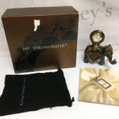 A boxed Jay Strongwater cast metal elephant figural clock decorated with hand set Swarovski crystals, approx height 15cm. Shipping category D.