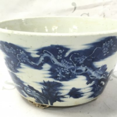 A Chinese blue and white planter bowl decorated with birds perched on cherry blossom trees. 11.5cm tall 21cm wide Approx . This lot cannot be posted