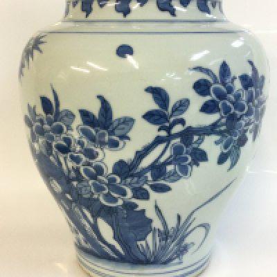 A Chinese blue and white vase with bird and floral decoration. 27cm tall approximately. This lot cannot be posted
