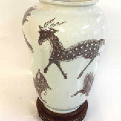 A Chinese iron red vase decorated with mythical creatures. With a six character mark at base. 26cm tall. This lot cannot be posted