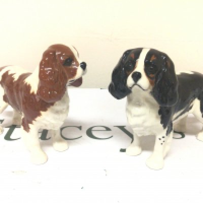 Two Beswick King Charles dog ornaments no obvious damage. (2)
