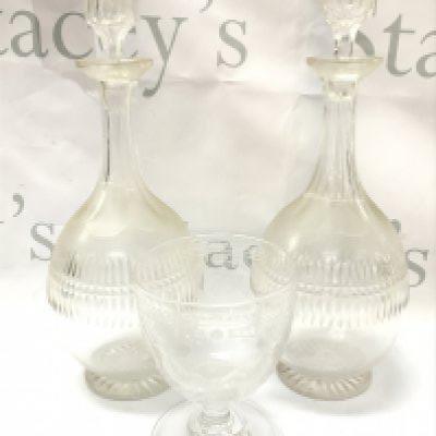 a Victorian masonic wheel etched goblet and a pair of decanters , chip on rim of goblet . This lot cannot be posted