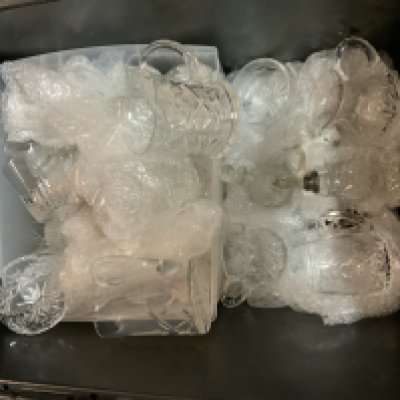 A large collection of cut glass and crystal. Decanters and glassware.