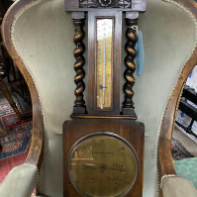 A Holland of London, brass dial oak barometer. 70cm.