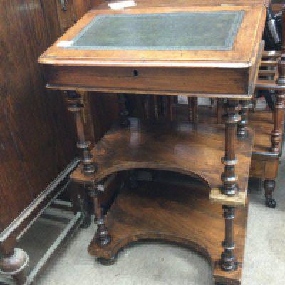 A Victorian mahogany Davenport&rsquo; the sloping front above pen sections