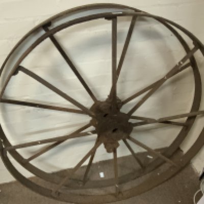 A large pair of cast iron wheels. 112cm diameter.