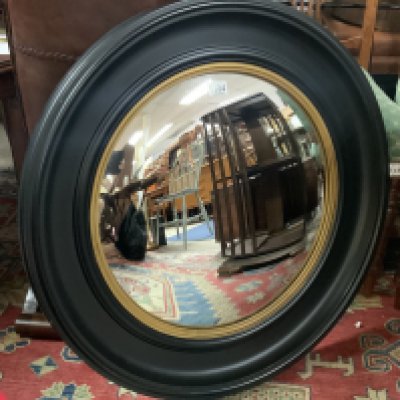 A large convex circular wall mirror, 74cm.