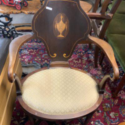 A small Edwardian bedroom chair with inlaid grecian urn design.