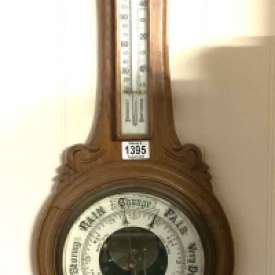 A carved oak framed barometer. No reserve.