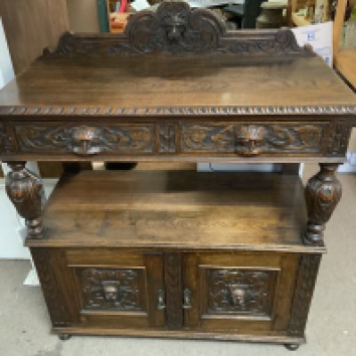 A 1930s oak carved Buffett. 106cm x 51cm x 126cm (No Reserve).