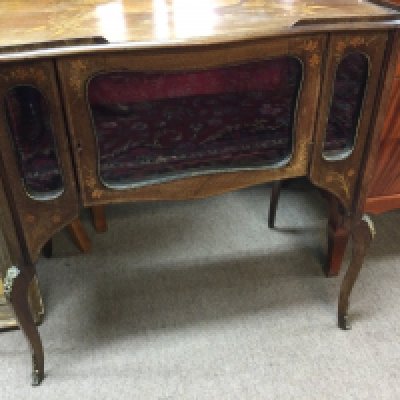A small Edwardian inlaid display cabinet the raised gallery above a single glazed door The cabriole legs with gilt mounts .