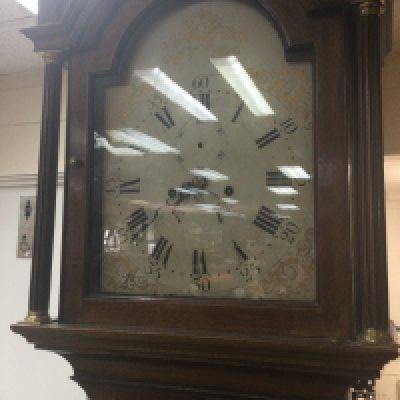 A mahogany long case the painted dial with Roman numerals.- NO RESERVE