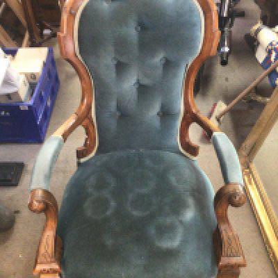 A Victorian walnut open arm chair, 104cm tall 65cm wide