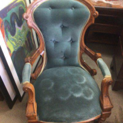 A Victorian walnut open arm chair, 104cm tall 65cm wide
