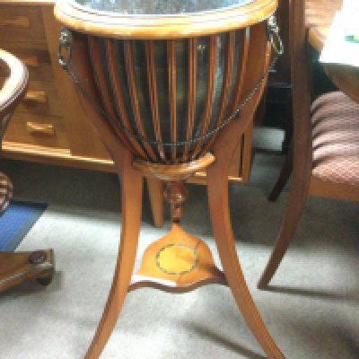 WITHDRAWN - A yew wood jardiniere stand of Classical style with inlaid stretcher and three splayed legs, approx height 83.5cm. Shipping category D.