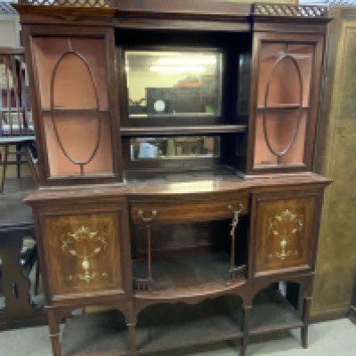 An Edwardian rosewood veneered sideboard with inlaid decoration.