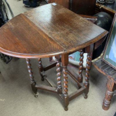 A small oak drop leaf table.