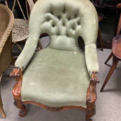A small Victorian walnut upholstered nursing chair.