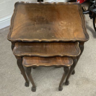A walnut nest of three tables.