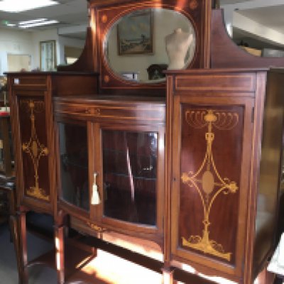 A Edwardian inlaid mahogany display cabinet the rasied mirror back above a pair of glazzed doors flanked by cupboards on square tappering legs . 150 cm x 200 cm . NO RESERVE