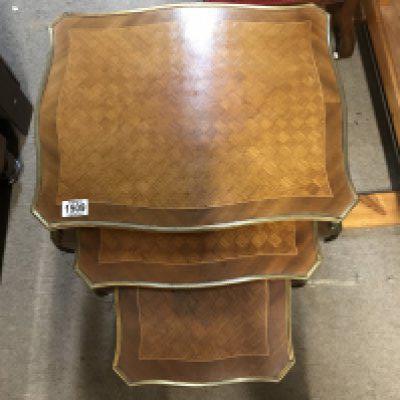A French gilt mounted marquetry nest of 3 tables. No reserve.