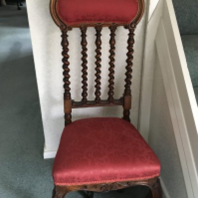 A Victorian carved walnut occasional chair the arched top rail above spirally turnings and conforming uprights.with an upholstered seat and back. NO RESERVE