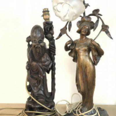 An Art Nouveau style simulated bronze lady figure lamp and a Chinese wooden carved figure lamp. This lot cannot be posted