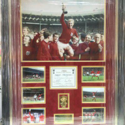 A framed and glazed limited edition 1966 England World Cup montage signed by goalscorers Geoff Hurst and Martin Peters, approx 69cm x 90cm. Comes with COA. Shipping category D.