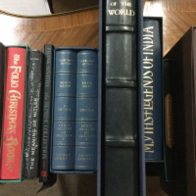 A collection of books including Folio Society .