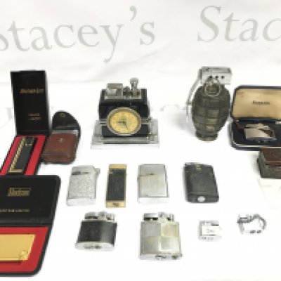 A collection of assorted lighters including a Ronson clock desk lighter. Postage B
